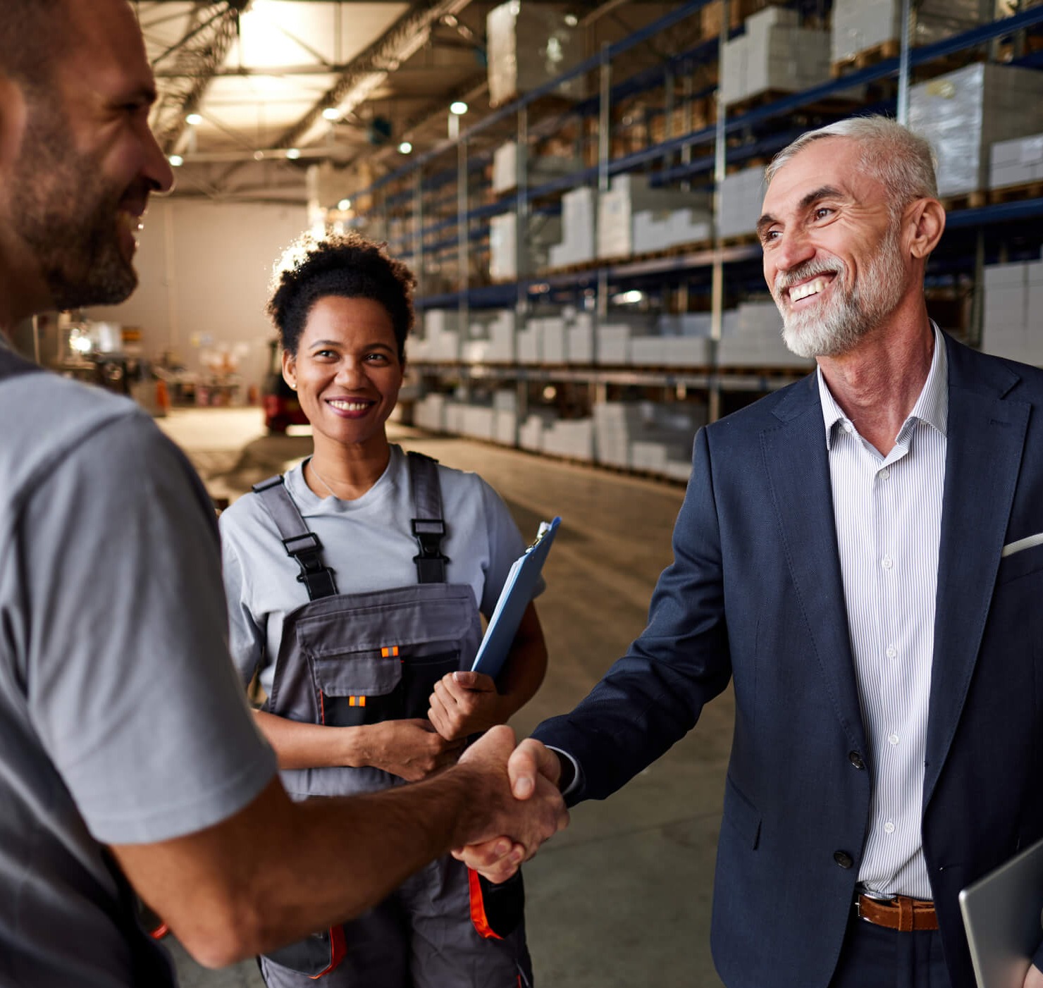 69091efb491c1019bf48a6a3_commercial real estate agent shakes hands with business owner